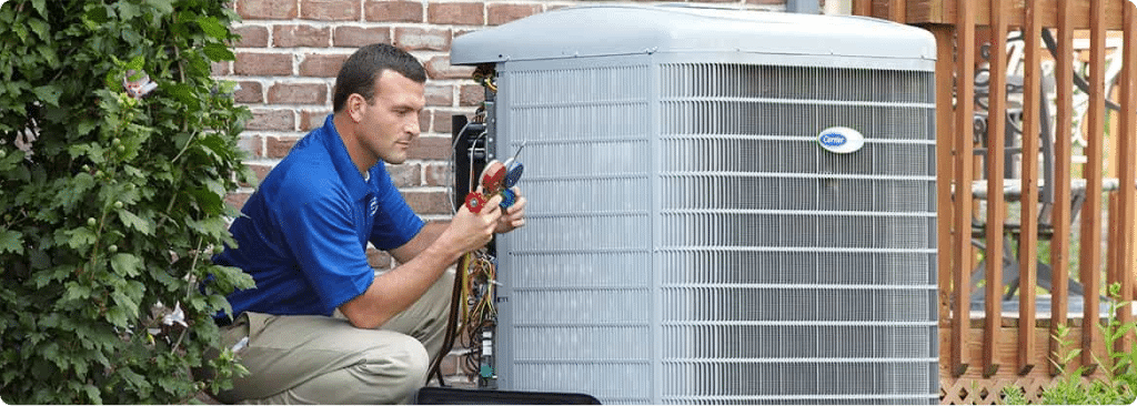 Technician performing AC maintenance for an Aurora IL home.